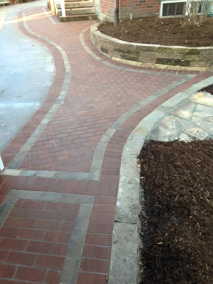 Curved paver driveway and entry walk — Fiddlehead Gardens Iowa City